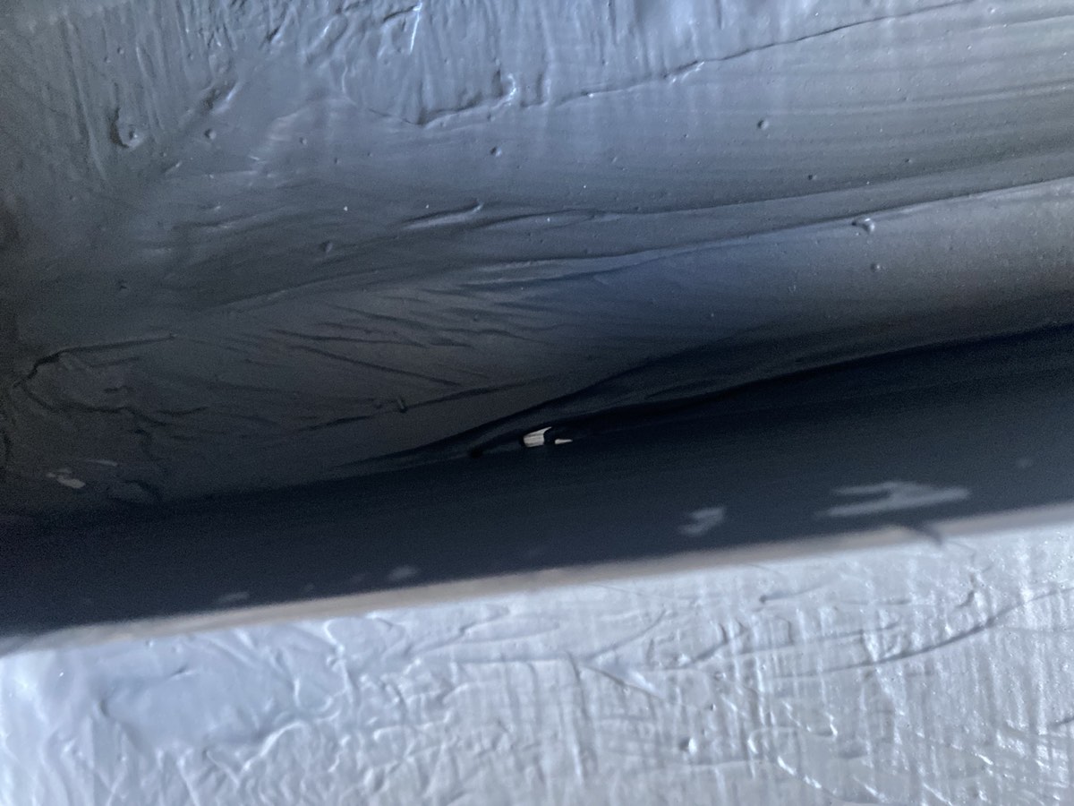 Pinhole in a shower recess, Box Hill